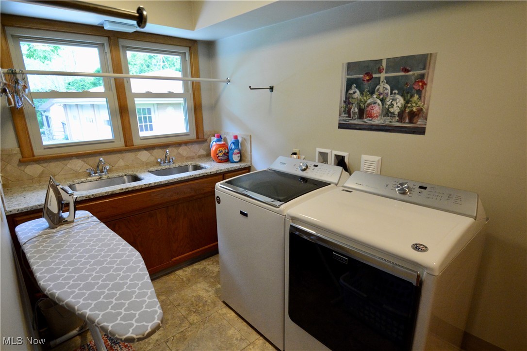 2724 Spitler Road Youngstown, OH 44514 - Photo 26 of 30 Washroom with washer and dryer, cabinet space, and light tile patterned floors