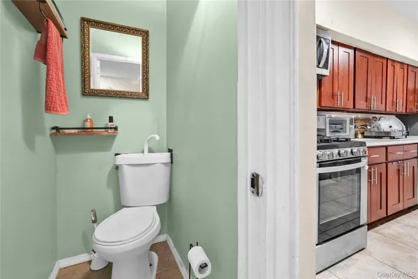 a white toilet sitting next to a bathroom sink