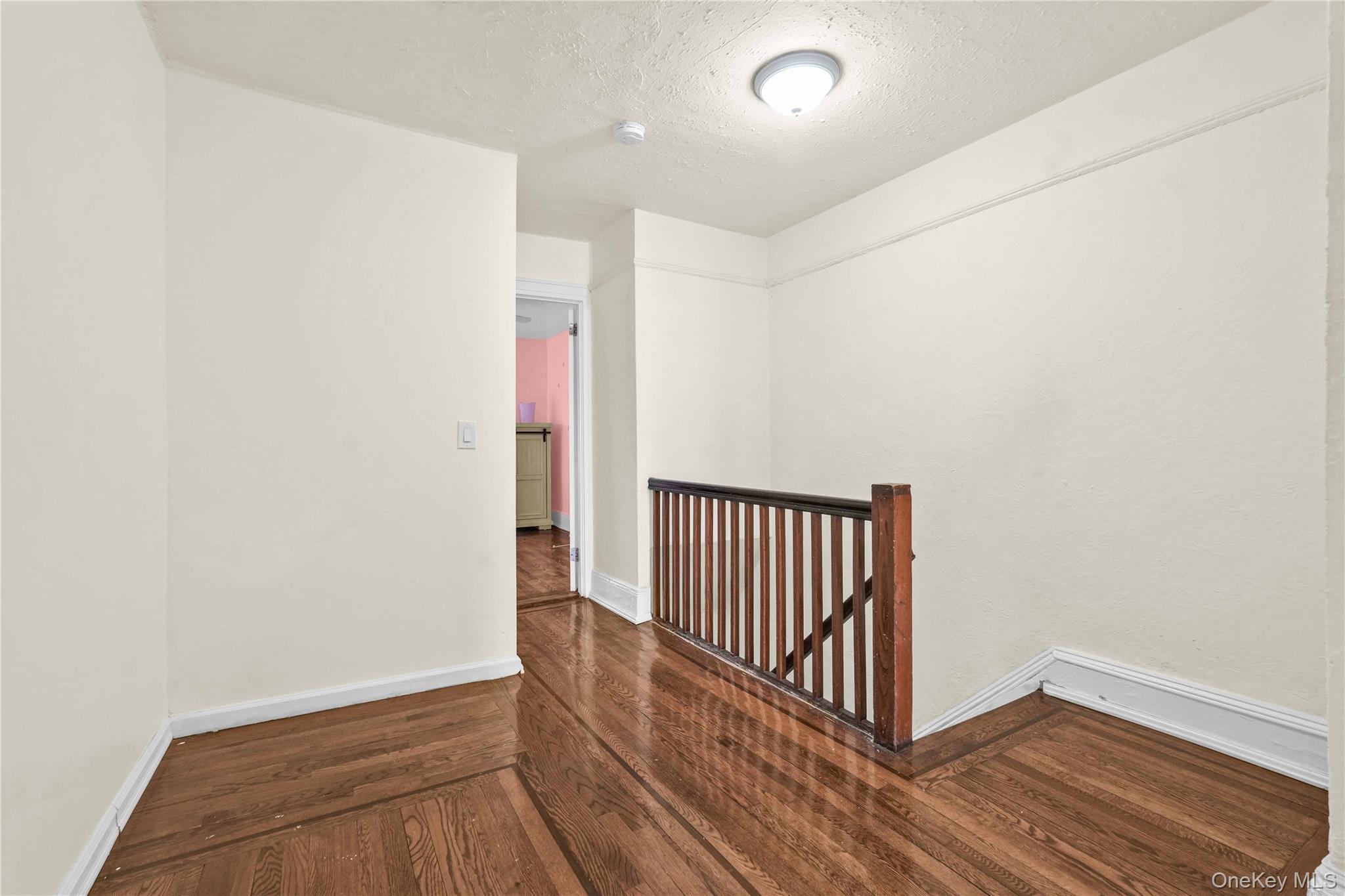 179-04 Selover Road Queens, NY 11434 - Photo 17 of 33 a view of a hallway with wooden floor