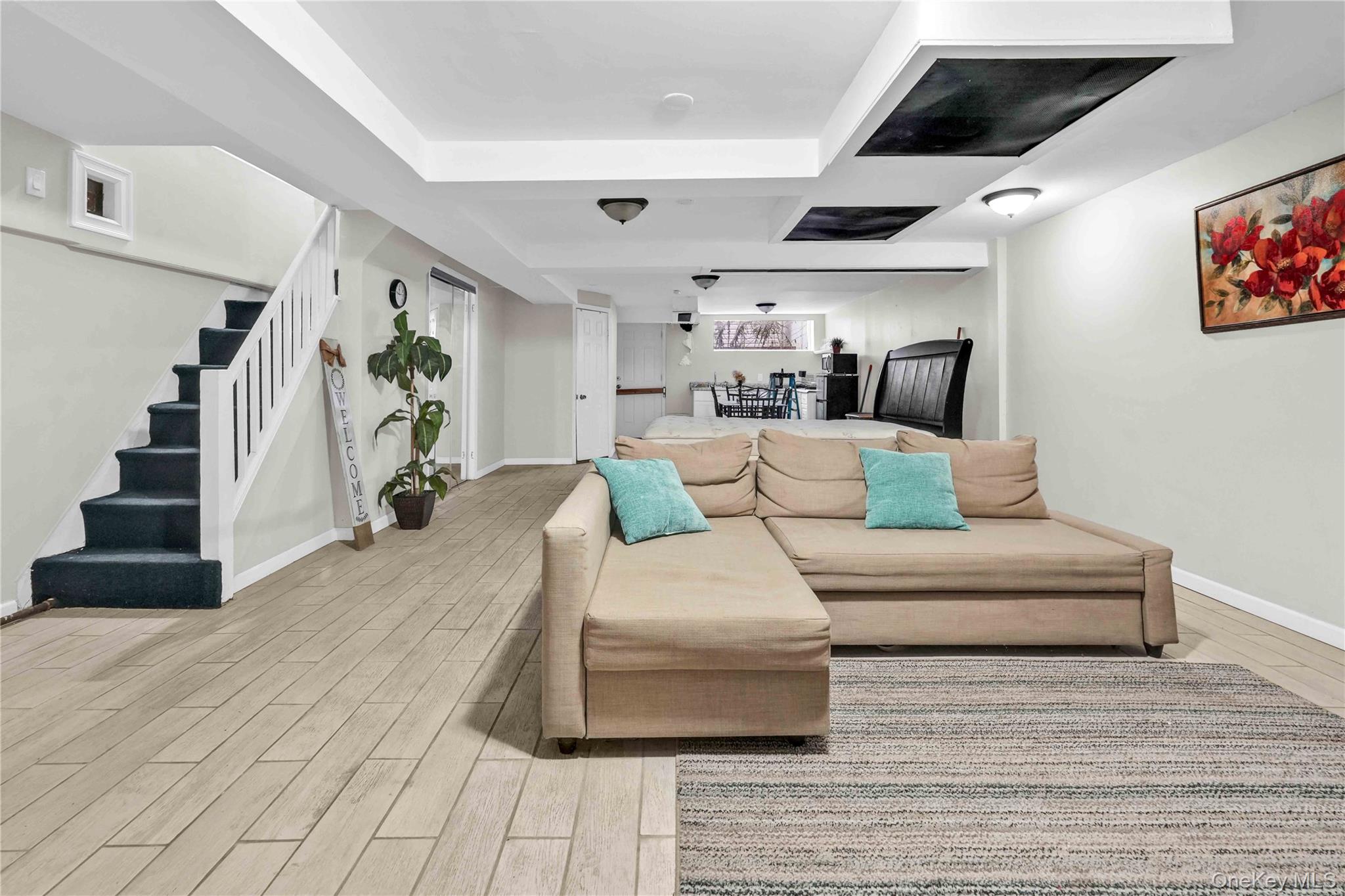 179-04 Selover Road Queens, NY 11434 - Photo 22 of 33 a living room with furniture and stairs