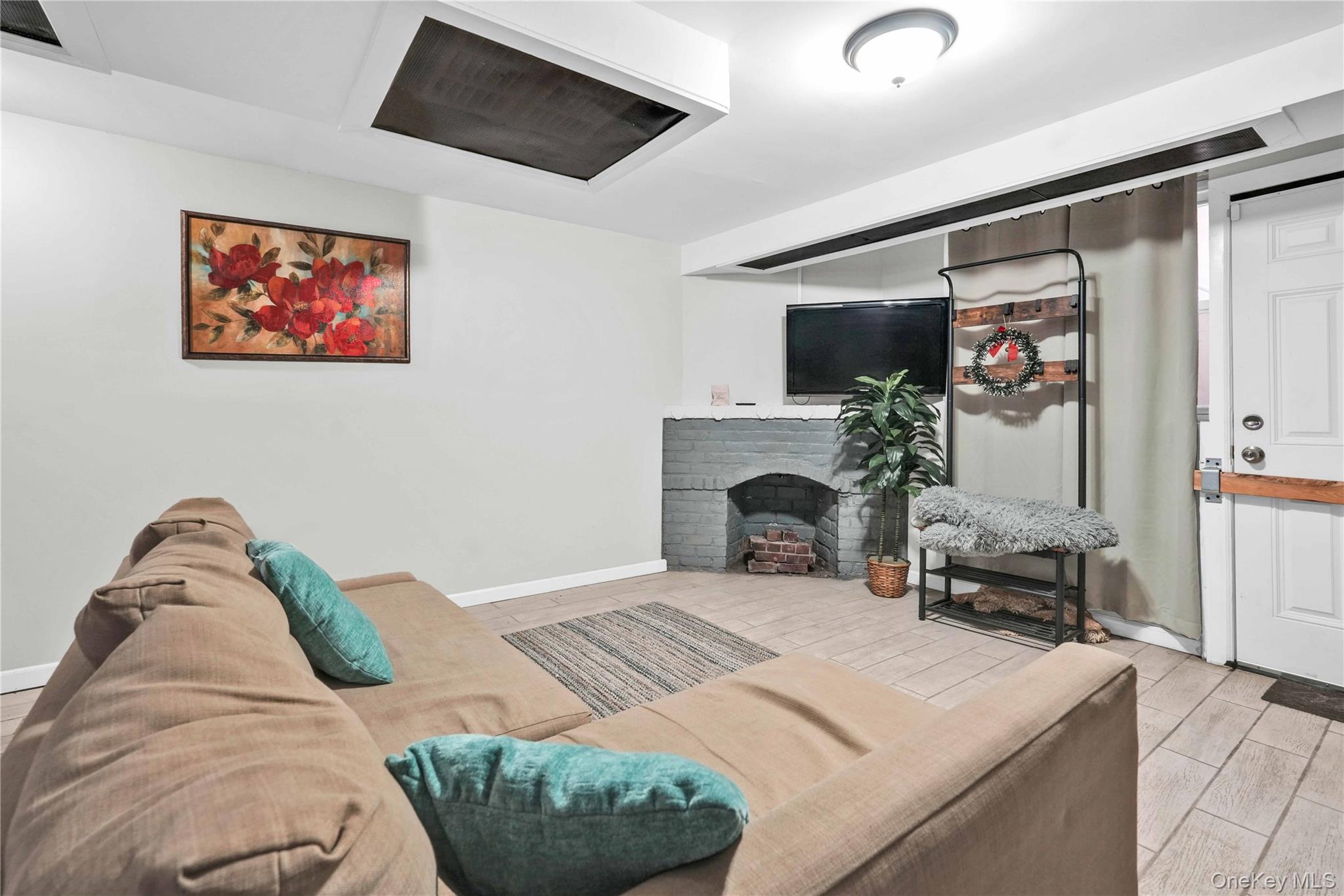 179-04 Selover Road Queens, NY 11434 - Photo 23 of 33 a living room with furniture and a fireplace