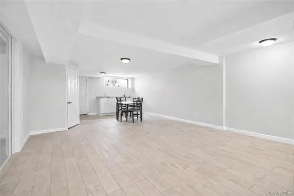 a view of dining room with furniture and wooden floor