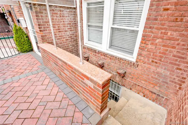 a view of a balcony with two chairs