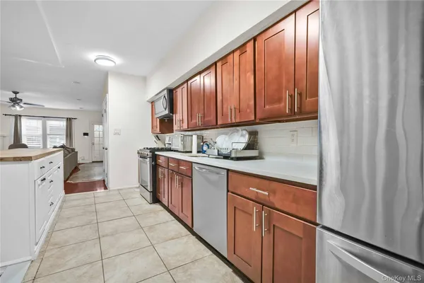 a kitchen with a cabinets window and appliances