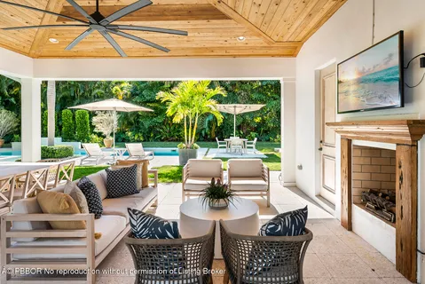 a view of a patio with couches dining table and chairs