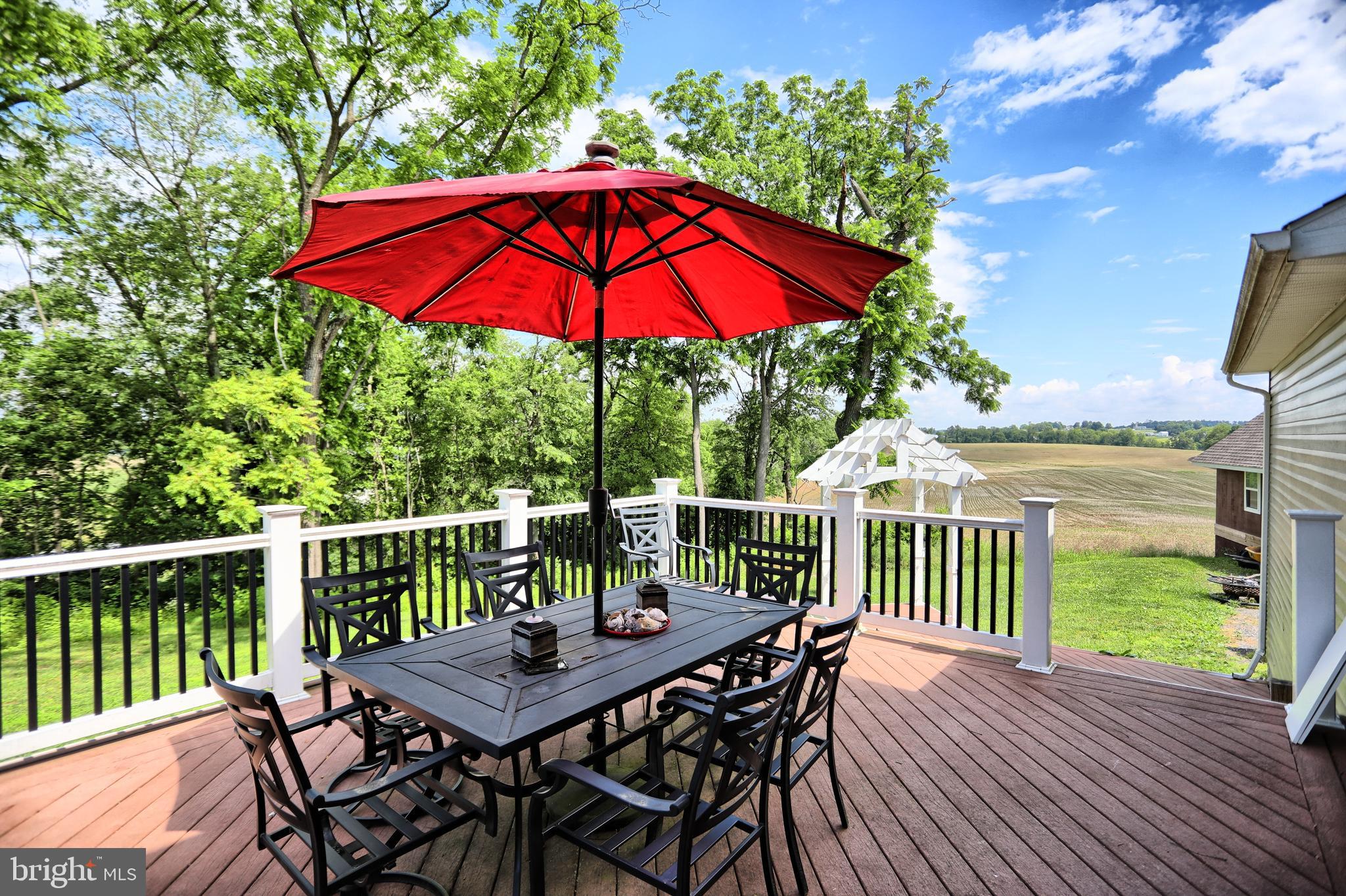 13008 Liberty Road Union Bridge, MD 21791 - Photo 35 of 69 a view of balcony with outdoor seating and wooden floor