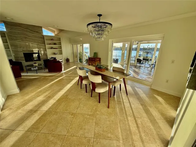 a kitchen with stainless steel appliances granite countertop a stove top oven a sink dishwasher and a refrigerator