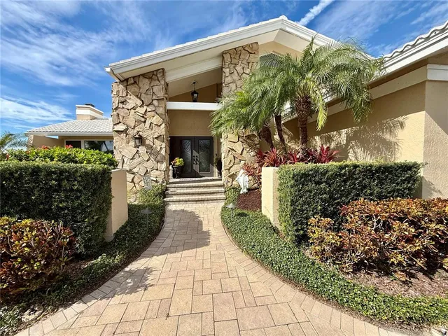 a view of a lake with houses in the back