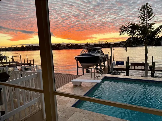 a view of a livingroom with furniture and a window