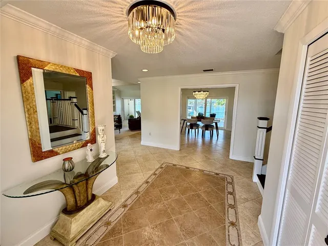 a living room with furniture and a lamp