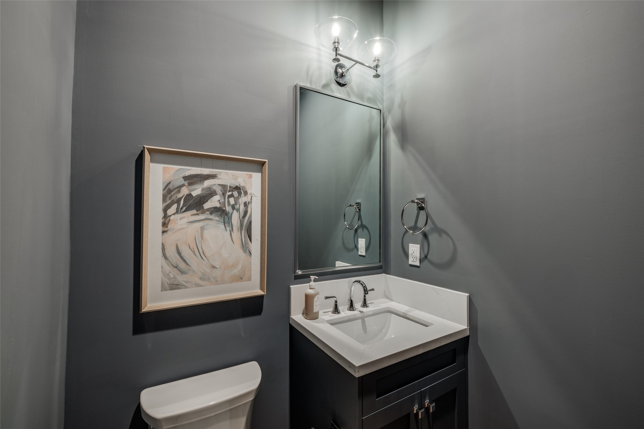 116 East 23rd Street Houston, TX 77008 - Photo 16 of 38 a bathroom with a toilet sink and mirror