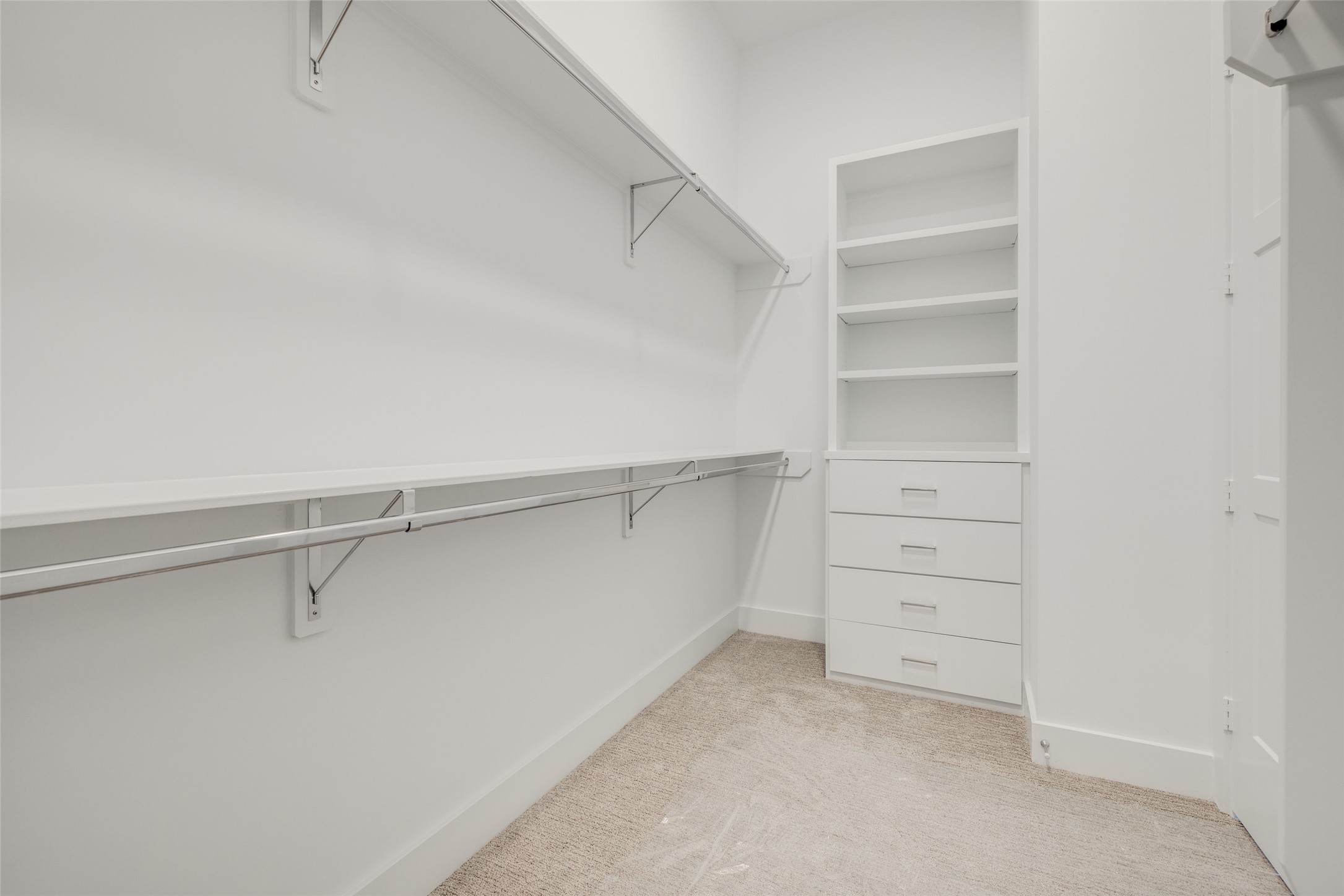 116 East 23rd Street Houston, TX 77008 - Photo 25 of 38 a view of walk in closet with empty racks