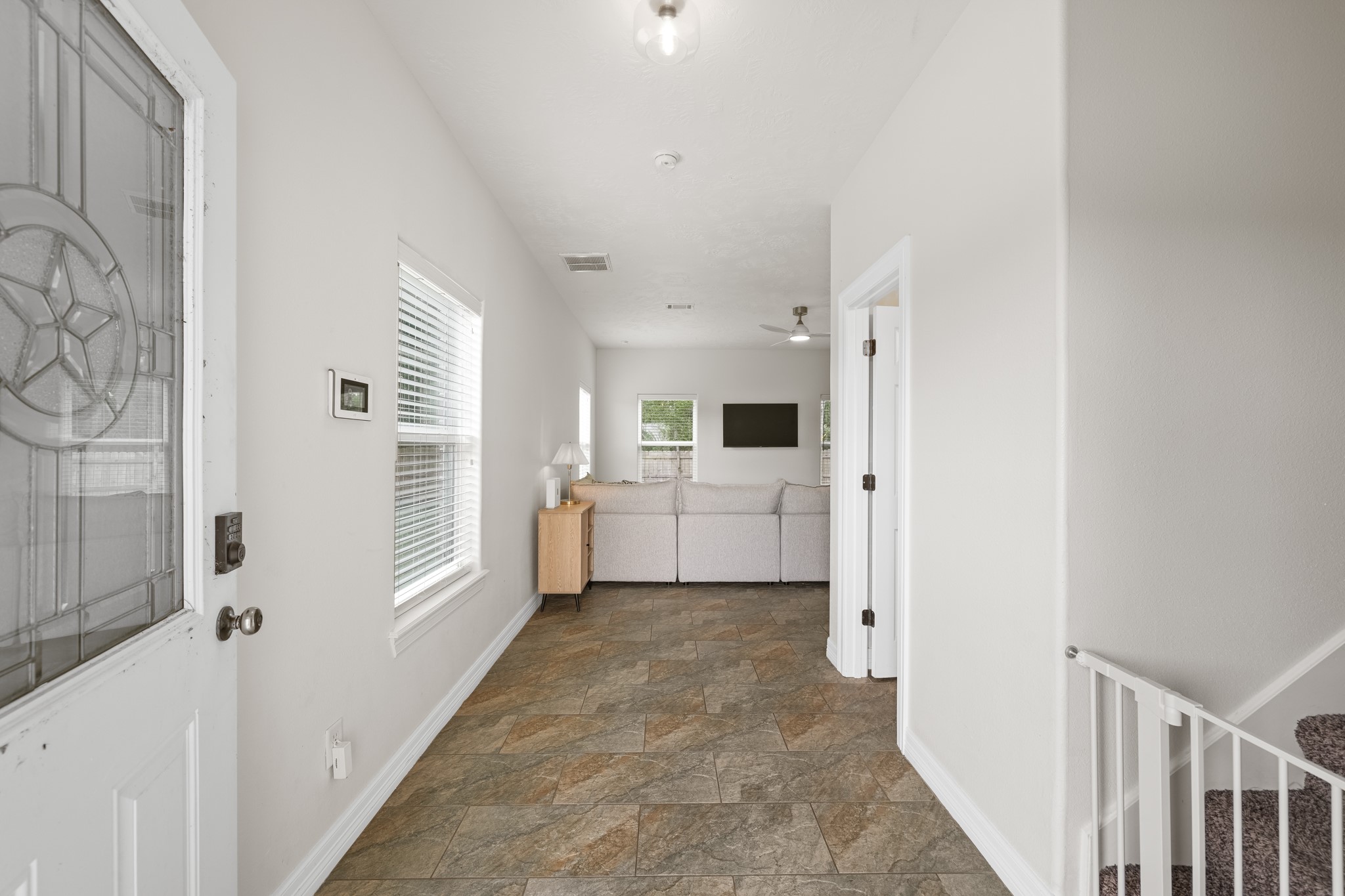 6101 Fox Ridge Drive Angleton, TX 77515 - Photo 7 of 30 a view of a kitchen with refrigerator and windows