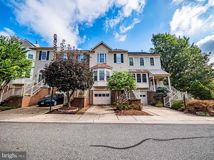 a view of house with yard in front of it