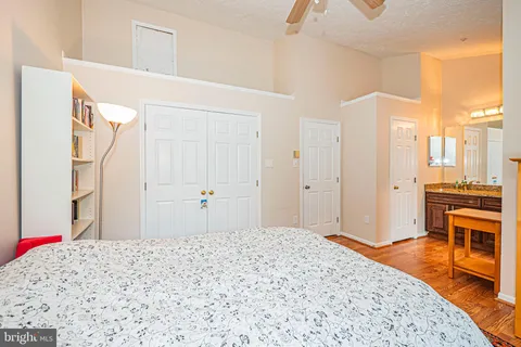 a bedroom with a bed and a stove