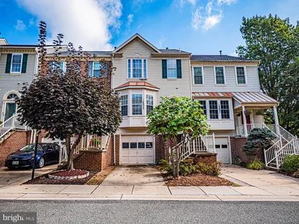a front view of a house with yard