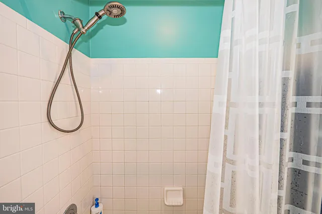 a picture of a bathroom with a shower