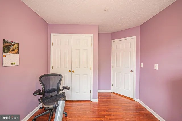 a view of workspace with wooden floor