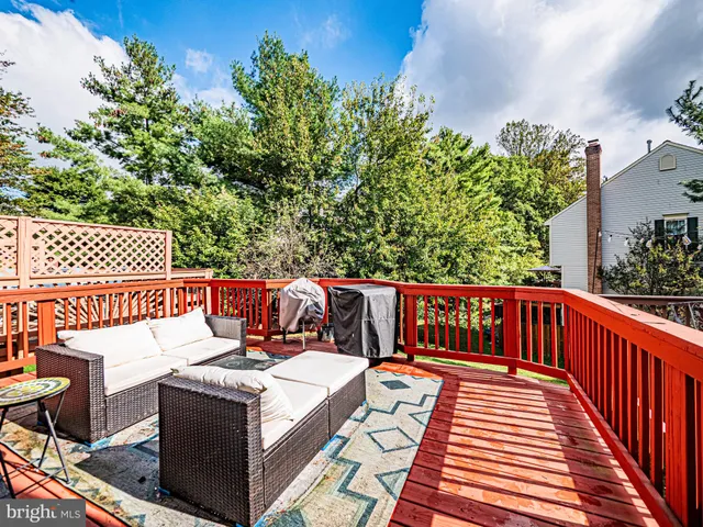 a view of an outdoor sitting area with wooden fence