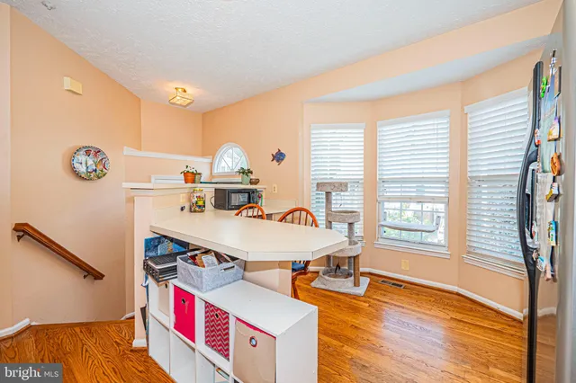 a room with furniture and a wooden floor