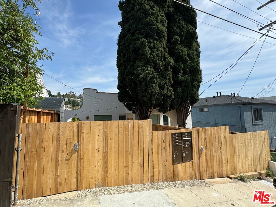 1946 Preston Avenue Los Angeles, CA 90026 - Photo 13 of 13 a view of a house with a wooden fence