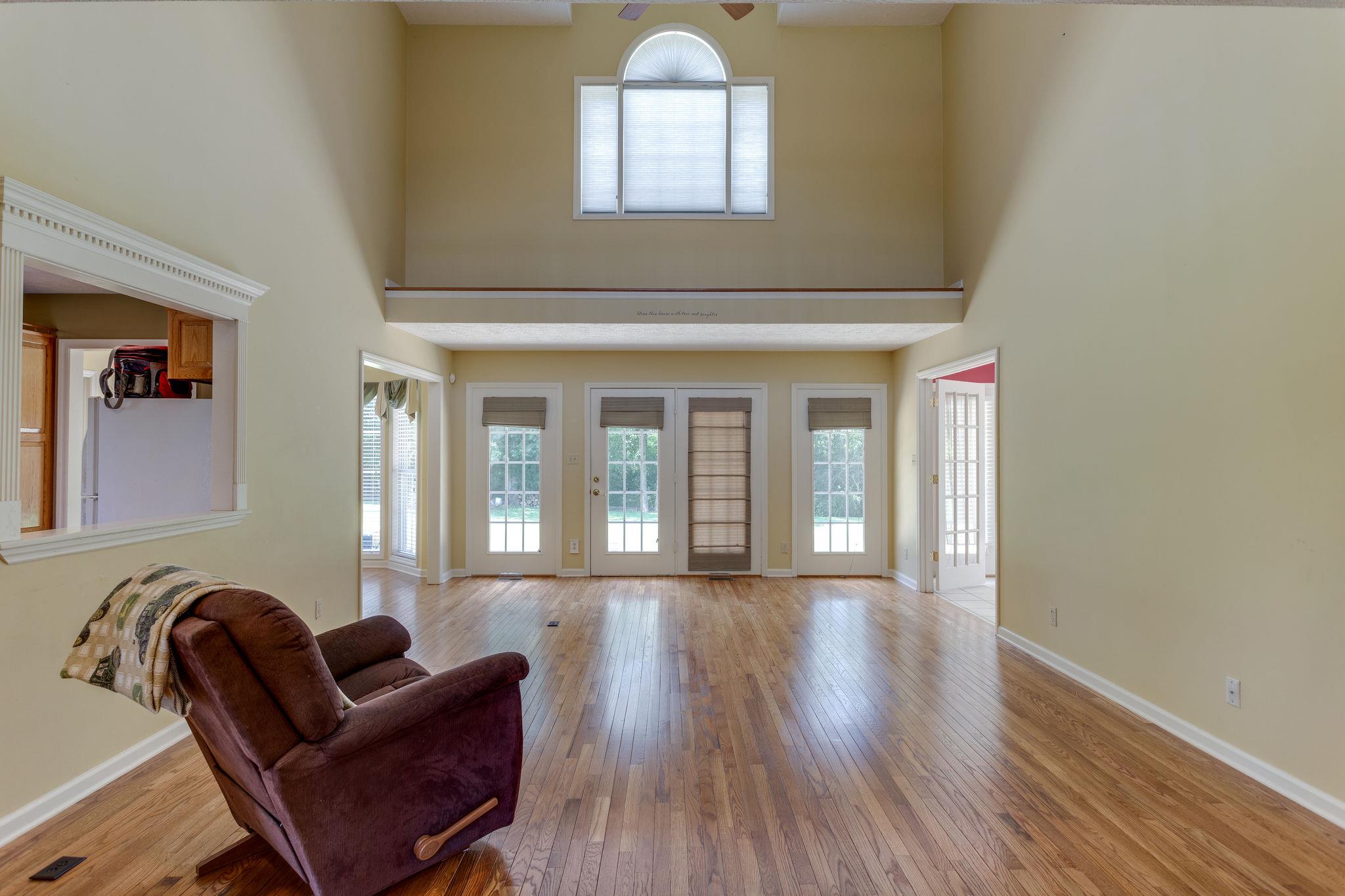 1909 Hunters Run Road Lewisburg, TN 37091 - Photo 14 of 30 Talk about making an impression!!! The ceilings in this living room are incredible along with all of the windows thorugh out the home!