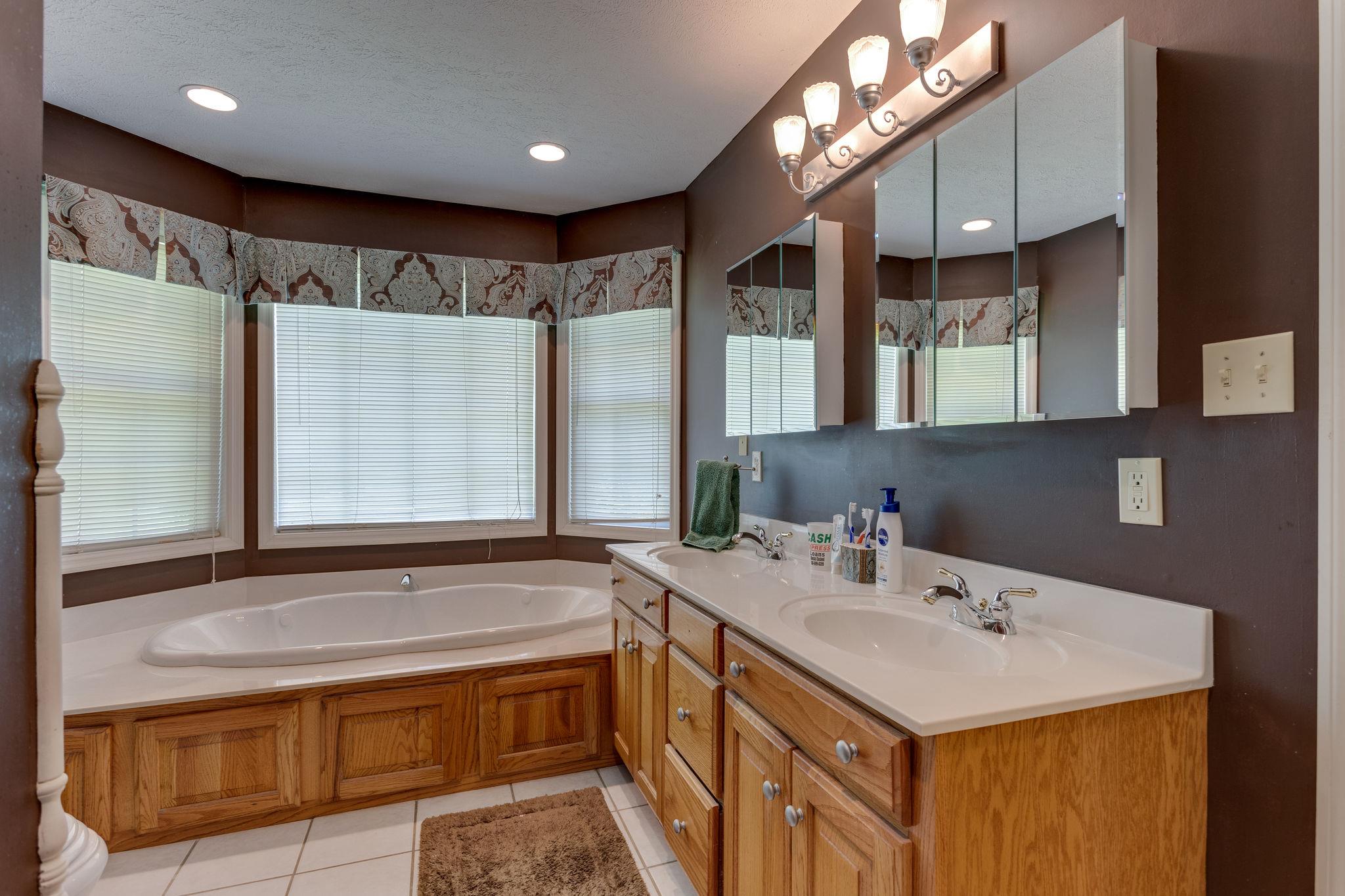 1909 Hunters Run Road Lewisburg, TN 37091 - Photo 18 of 30 Downstairs master bath with separate tub, shower, double vanity, and a nice walk in closet.