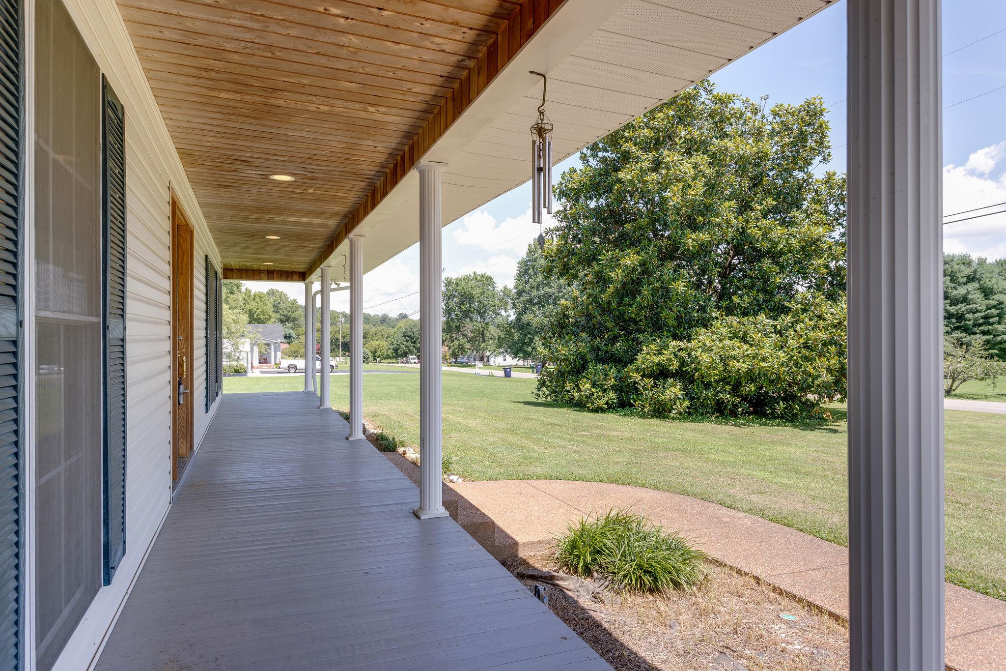 1909 Hunters Run Road Lewisburg, TN 37091 - Photo 3 of 30 That rocking chair front porch you always dreamed of! Imagine cooling of with a glass of lemonade here on a hot summer day!!!