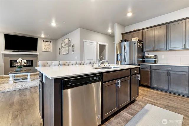 a kitchen with a sink stove and refrigerator