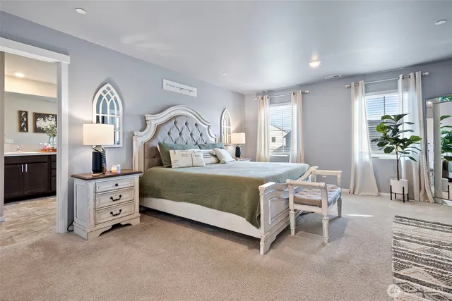 a bedroom with a bed and a dresser in it