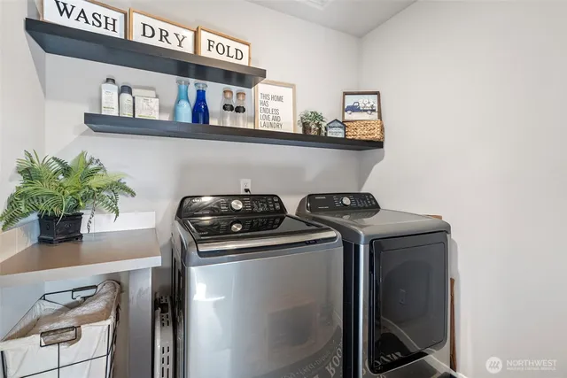 a utility room with dryer and washer