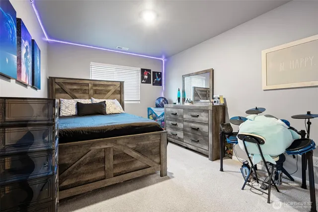 a bedroom with a bed and a cabinets