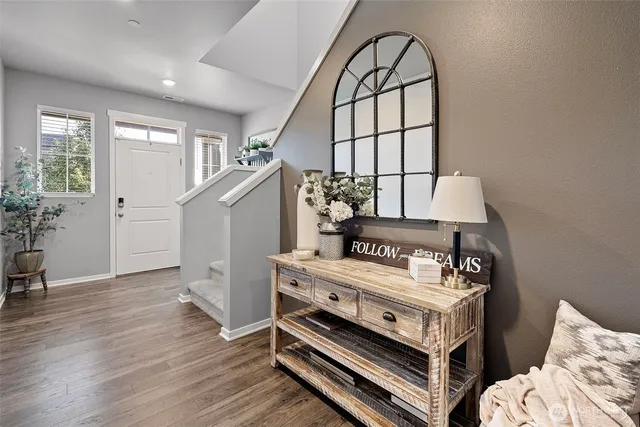 a view of bedroom with furniture and a window