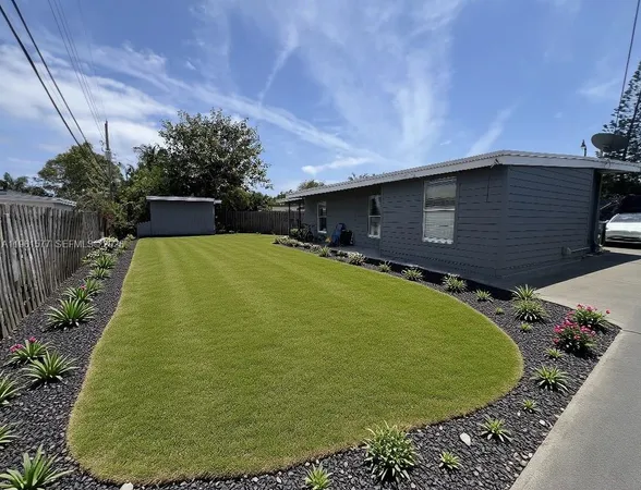 a front view of house with yard