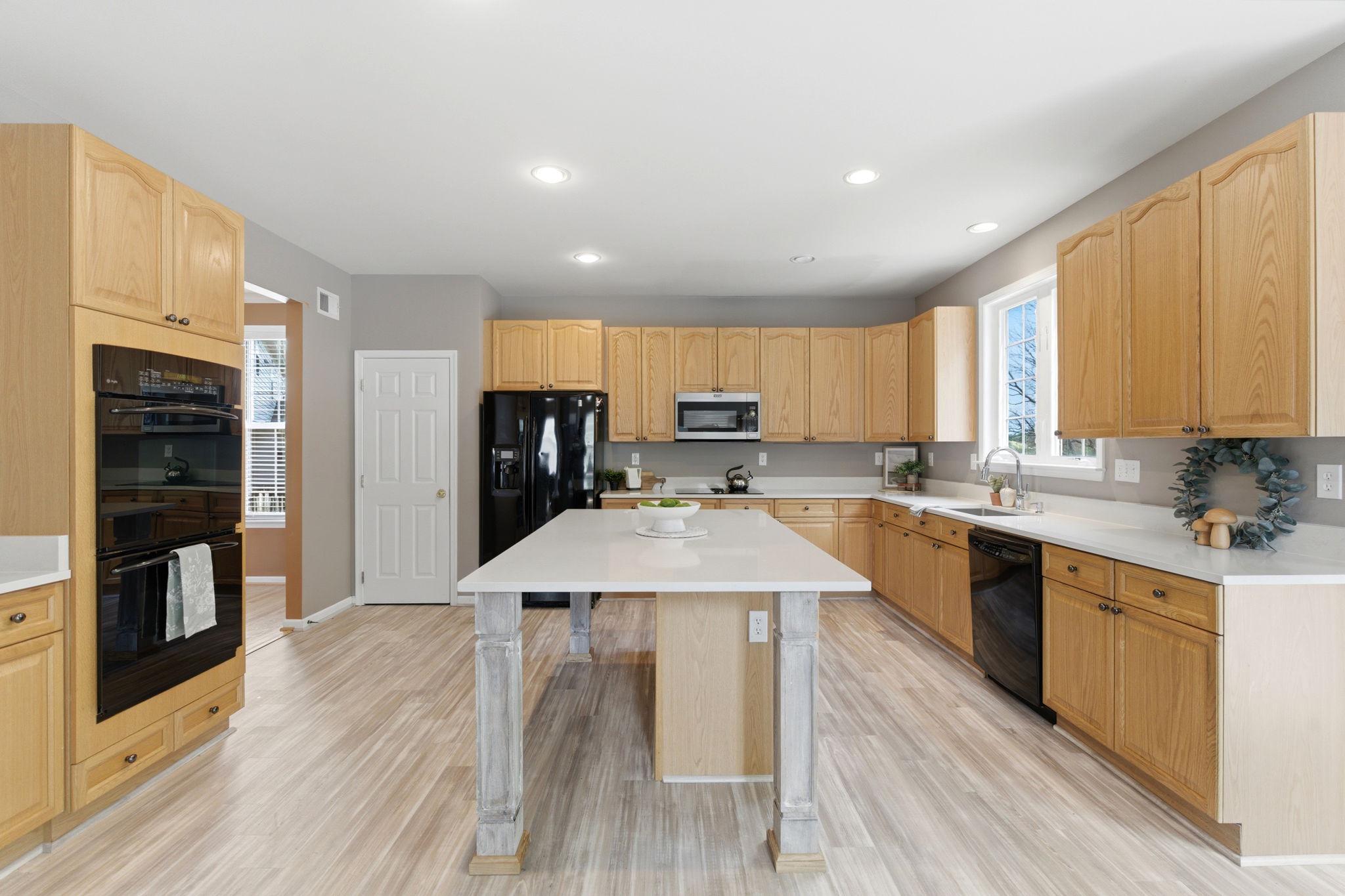 457 Hughs Road Charles Town, WV 25414 - Photo 16 of 73 Spacious kitchen with modern finishes.