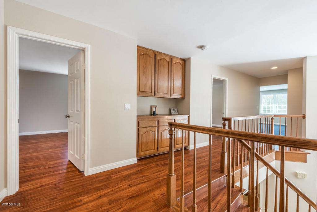 3403 Fayance Place Thousand Oaks, CA 91362 - Photo 18 of 23 a view of a hallway with wooden floor and staircase