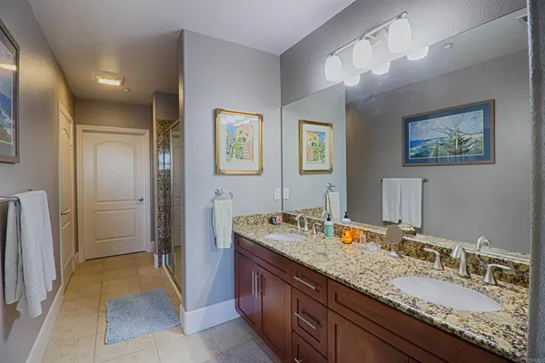 a bathroom with a shower and a glass door