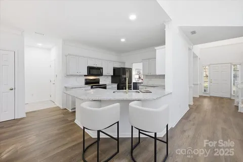 a view of kitchen with breakfast area