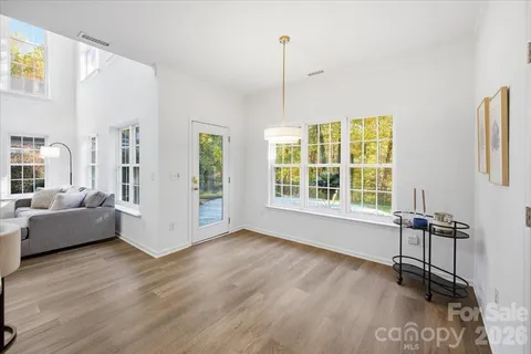 a view of livingroom with furniture wooden floor and windows