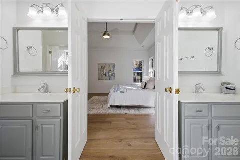 a en suite bathroom with a toilet sink and mirror