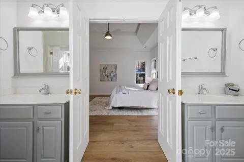 a en suite bathroom with a toilet sink and mirror
