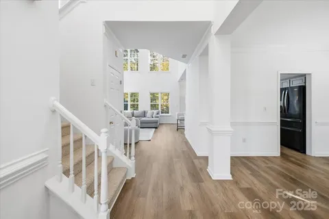 a view of an entryway with wooden floor