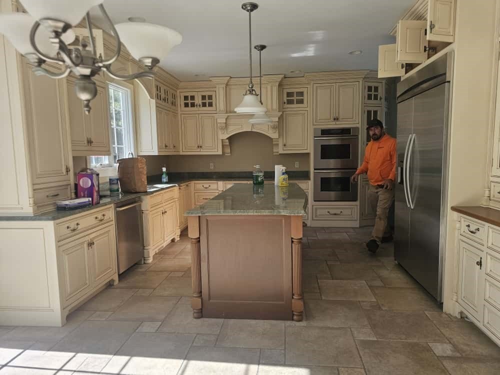 4 Shoe String Lane Westwood, MA 02090 - Photo 12 of 28 a kitchen with stainless steel appliances kitchen island granite countertop a refrigerator and a stove top oven