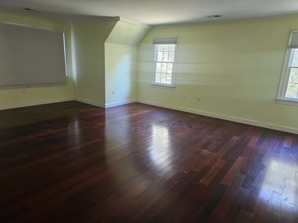 4 Shoe String Lane Westwood, MA 02090 - Photo 13 of 28 an empty room with wooden floor and windows