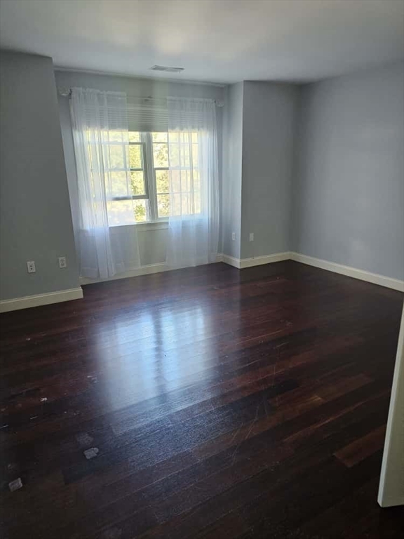 4 Shoe String Lane Westwood, MA 02090 - Photo 14 of 28 an empty room with wooden floor and windows