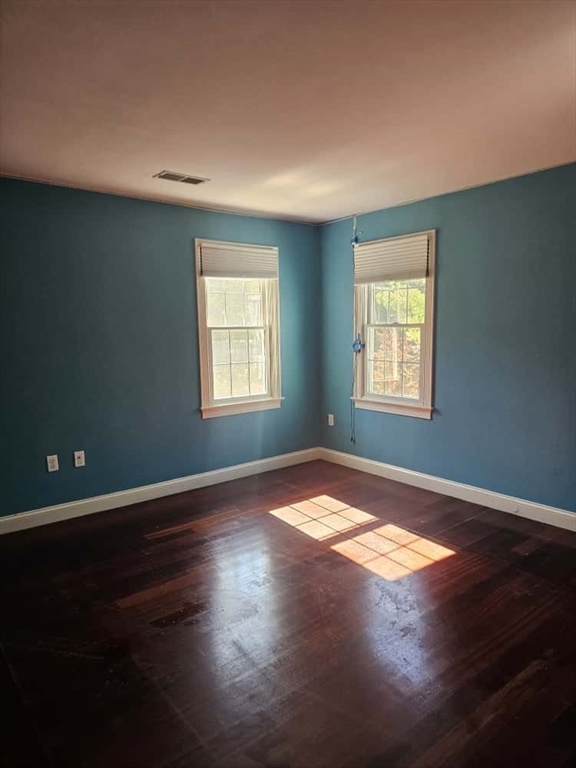 4 Shoe String Lane Westwood, MA 02090 - Photo 15 of 28 a view of an empty room with window and wooden floor