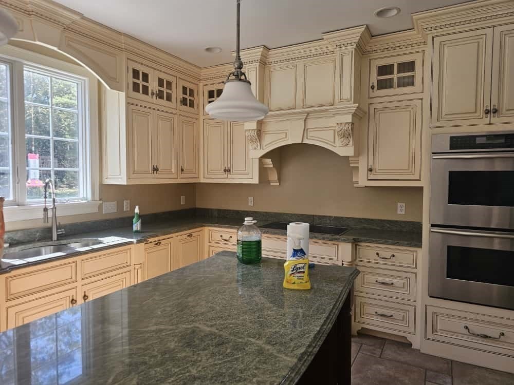 4 Shoe String Lane Westwood, MA 02090 - Photo 10 of 28 a kitchen with granite countertop a sink a stove and cabinets