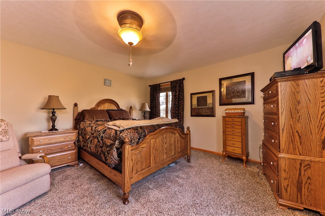 1798 Center Road Avon, OH 44011 - Photo 12 of 30 Master bedroom with newer flooring throughout.