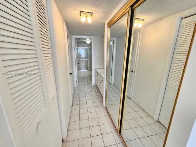 a view of a bathroom from the hallway