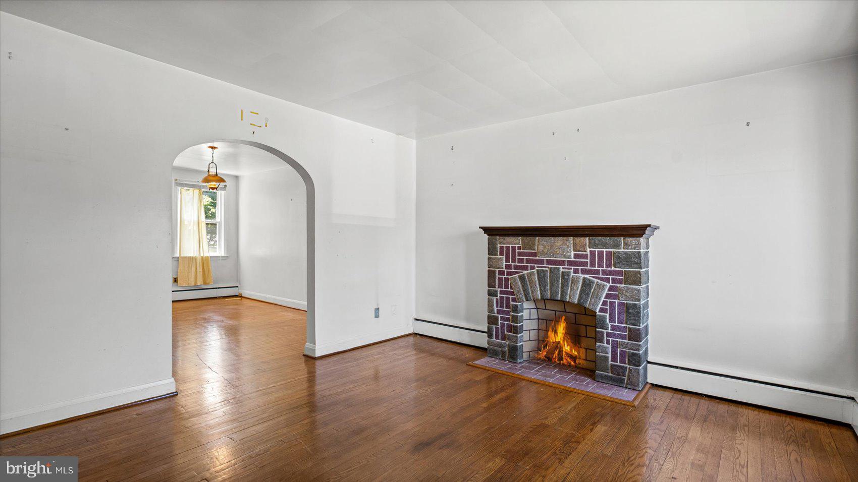 1805 Crestview Road Baltimore, MD 21239 - Photo 4 of 39 a view of empty room with wooden floor